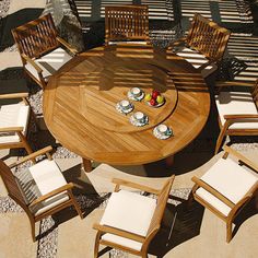 a wooden table with chairs around it