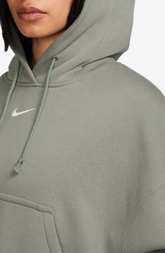 Supersoft fleece means all-day comfort in a dropped-shoulder hoodie perfect for relaxing at home or heading to the gym. 24 1/2" length (size Medium) Drawstring hood 80% cotton, 20% polyester Machine wash, tumble dry Imported Nike Sportswear Phoenix Fleece, Khaki Green, Nike Sportswear, Fleece Hoodie, Phoenix, Pullover Hoodie, Gym, Size Medium, Nike