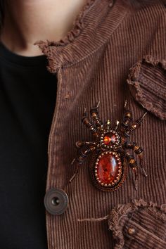 "Spider brooch it is embroidered brooch by bead and gimp. This woodlander jewelry is best Halloween gift. Spider jewelry has a has a size approximately 3.2*2.7 inches (8*7 cm). Beaded spider brooch, designer's jewelry inspired by Nature - insect brooch Spider with imitation of amber, Czech crystal beads. It will perfectly complement your unique jewelry collection or will be a wonderful gift as a Halloween brooch. Looks very elegant! A Spider jewelry brooch is carefully bead embroidered on leathe Handmade Brooches For Halloween Gift, Spider Jewelry, Beaded Spiders, Bead Embroidery Jewelry, Czech Crystal, Halloween Photos, Halloween Jewelry, Halloween Gifts, Beaded Embroidery