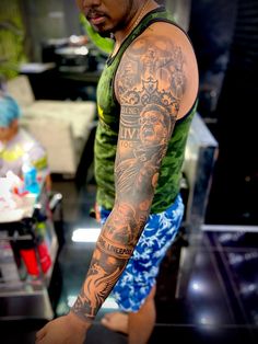 a man with many tattoos on his arm