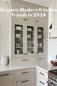 a kitchen with white cabinets and silver appliances in the center, is featured on this page