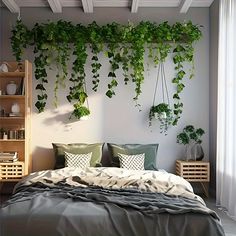 a bed with green plants hanging from the ceiling and pillows on it's headboard