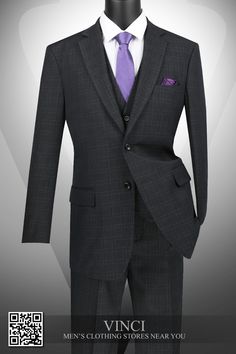 a mannequin wearing a suit and purple tie