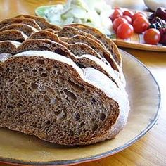 sliced loaf of bread sitting on top of a plate