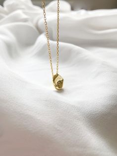 "Beautiful and delicate dainty gold filled necklace, perfect for everyday wear. This nugget pendant necklace in 14k gold filled with sterling silver. Necklace Length: 15 1/2\" + extension 2\" ♥Shipping♥✈ It will take approx 3-5 business days to US, and 1 - 2 weeks to all of the countries. All orders would be shipped it out within 1 to 2 business days. ♥GREETINGS♥ If you are buying gifts for someone and have them mailed to the person directly, we are always happy to add a personal greeting for yo Tiny Gold Plated Gold Necklaces, Tiny Gold Round Pendant Necklace, Gold Tiny Round Pendant Necklace, Tiny Gold Minimalist Charm Necklaces, Gold Delicate Minimalist Charm Necklaces, Small Gold Round Pendant Necklace, Minimalist Gold Plated Oval Pendant Charm Necklace, Everyday Gold Oval Pendant Charm Necklaces, Gold Oval Pendant Charm Necklaces For Everyday