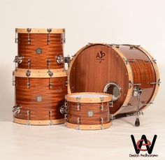 three wooden drums sitting next to each other