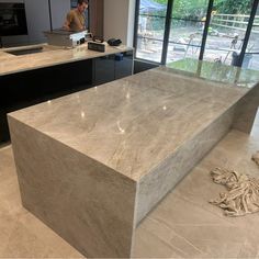 a man standing in front of a counter top