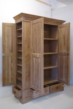 an open wooden cabinet with drawers on both sides