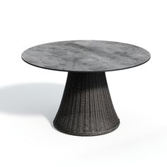 a round table with black wicker base and grey marble top on an isolated white background