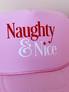 All those who are equal parts naughty and nice, this one is for you! We're in love with our newest hat! Naughty & Nice is printed in red and white on this foam trucker hat. The hat is a pink foam trucker hat with a mesh back, and it has as an adjustable snapback enclosure. The perfect trucker hat for all you who love some holiday cheer! Made in USA Pink Foam Trucker hat with mesh back Snapback design ensures perfect fit Novelty Pink Hat With Letter Print, Pink Novelty Hat With Letter Print, Fun Pink Trucker Hat With Letter Print, Novelty Red Trucker Hat, Pink Novelty Trucker Hat Adjustable, Cute Pink Trucker Hat With Letter Print, Pink Letter Print Trucker Snapback Hat, Pink Trucker Hat As Gift, Pink Trucker Hat With Letter Print