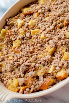 a casserole dish filled with meat and vegetables