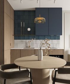 a dining room table with chairs around it in front of a blue cabinet and counter