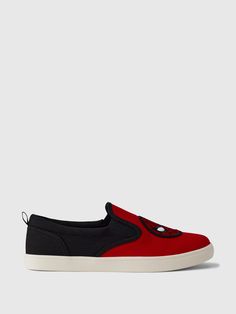 a pair of red and black slip ons