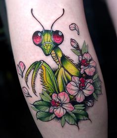 a tattoo with an image of a praying mantissa on it's leg