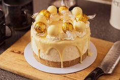 a cake sitting on top of a wooden cutting board