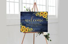 an easel with a sign that says welcome and sunflowers on it