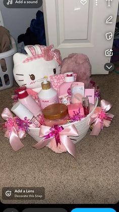 a hello kitty gift basket is sitting on the floor