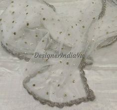 This is a Dupatta made on orders. It is made using dyeable net fabric with silver pearl work all over. We stitch a beautiful silver lace to all sides of it. Dupatta is having a length of 100 inches and width of around 40 inches. I don't keep it readymade I only make it exclusively for my customers. Can be fully customised. White Dupatta Designs With Lace, Net Duppata Designs, Net Shawl Designs, White Dupatta Designs, Work Dupatta Designs, Dupata Laces, Net Dupatta Designs Ideas, Duppata Designer Lace, Net Dupatta Designs