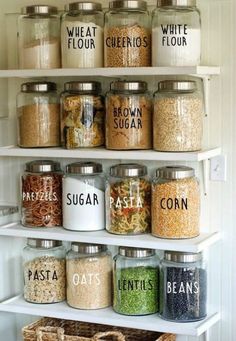 an organized pantry filled with lots of different types of spices and grains in glass jars