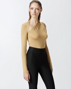 Long-sleeved bodysuit in warm-textured stretch modal jersey that feels pleasant on the skin. The bodysuit's slim fit is accompanied by a pointed asymmetric neckline with gathering to provide extra movement. Elegant Stretch Bodysuit With Asymmetrical Neckline, Elegant Fitted Bodysuit With Asymmetrical Neckline, Fitted Bodysuit With Asymmetrical Neckline For Evening, Fitted Bodysuit With Asymmetrical Neckline For Night Out, Evening Bodysuit With Asymmetrical Neckline, Chic Stretch Bodysuit With Asymmetrical Neckline, Asymmetrical Stretch Bodysuit For Evening, Asymmetrical Stretch Bodysuit For Night Out, Chic Asymmetrical Stretch Bodysuit