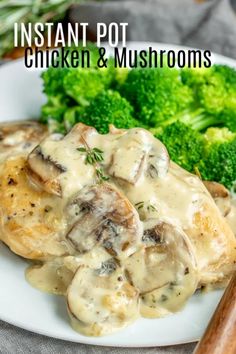 a white plate topped with chicken and mushrooms covered in gravy