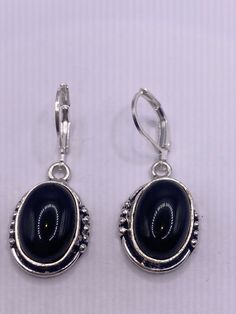 Vintage Black Onyx Earrings 925 Sterling Silver Deco dangle chandelier  Delicate and detailed vintage Sterling Silver Black onyx earrings  These dangle earrings are over 1 inch long Can be converted to clip ons.  All jewelry is shipped in a nice gift box.   Check out our over a THOUSAND great reviews Vintage Black Oval Earrings, Black Oval Vintage Earrings, Black Oval Pierced Earrings, Vintage Black Dangle Jewelry, Classic Onyx Dangle Jewelry, Black Dangle Clip-on Jewelry, Black Clip-on Dangle Jewelry, Classic Black Dangle Jewelry, Vintage Black Sterling Silver Earrings