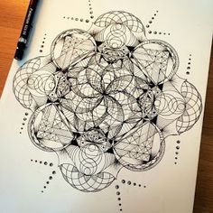 a drawing on paper with some lines and circles in the middle that are connected to each other