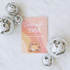 an image of a birthday party with disco balls on the bed and a vintage book