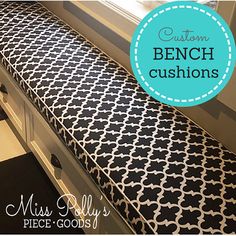 a black and white patterned bench cushion on a window sill with the words custom bench cushions above it