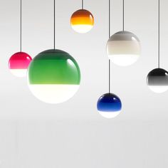 an assortment of multicolored lights hanging from the ceiling