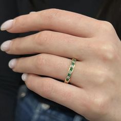 Clean And Simple, This Fabulous Channel Set Band Ring Is Encrusted With 5 Round Cut Emeralds And 4 Round Brilliant Cut Diamonds. Total Diamond Weight: 0.20 Carat. Total Emerald Weight: 0.25 Carat. Crafted In 14k Yellow Gold. Ring Size 6.25. Width: 3.2 Mm. Weight: 2.33 Grams. Excellent Preowned Condition. Comes With A Presentable Gift Box. Id: 02449 Classic Green Eternity Promise Ring, Classic Green Eternity Band For Formal Occasions, Luxury Channel Set Emerald Ring For Anniversary, Classic Green Gemstone Eternity Band, Luxury Yellow Gold Half Eternity Emerald Ring, Formal Fine Jewelry Emerald Ring Channel Set, Green Diamond Channel Set Rings, Elegant Yellow Gold Emerald Ring With Channel Set, Classic Green Eternity Band For Anniversary