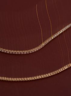 Popularized by famous tennis player Chris Evert in 1987 during the US Championships, the tennis bracelet is an all time favorite.A step up, the 16-18" tennis necklace sits perfectly on your collarbone. Wear her without anything else. Looking for something a little thinner? Shop the Petite Diana Diamond Tennis Necklace. Or shop the Diana Diamond Tennis Bracelet here. This piece is made to order. Please allow at least 2-3 weeks for production. Designed and created in Los Angeles with ethically and Luxury Yellow Gold Tennis Necklace For Engagement, Timeless Gold Single Strand Tennis Necklace, Gold Single Strand Tennis Necklace, Gold Tennis Necklace With Brilliant Cut For Everyday Luxury, Gold Brilliant Cut Tennis Necklace For Everyday Luxury, Rose Gold Diamond Tennis Necklace For Formal Occasions, Everyday Luxury Gold Tennis Necklace With Brilliant Cut, Formal Rose Gold Diamond Tennis Necklace, Luxury Single Strand Yellow Gold Tennis Necklace