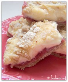 three pieces of dessert sitting on top of a pink plate