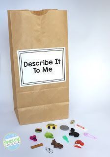 a brown paper bag filled with magnets next to a white cup and some other items