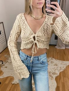 Best seller! The cutest Thick Crochet Long Sleeve Top ft. Middle Self Tie. Can be worn as a bathing suit cover up or would be perfect for a country concert! Pair with our Kylie Bralette i﻿n Beige or White! Maclaine is wearing a size small. Belle Sleeves & slightly relaxed fit! Available in white & beige. Crochet Long Sleeve Top, Thick Crochet, Crochet Long Sleeve Tops, Denim Shorts Outfit, White Crochet Top, Bathing Suit Cover, Dresses Style, Bathing Suit Covers, Country Concert