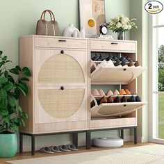 a wooden cabinet with shoes and purses on it next to a potted plant