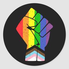 a sticker with a rainbow colored hand holding a piece of cake in the middle