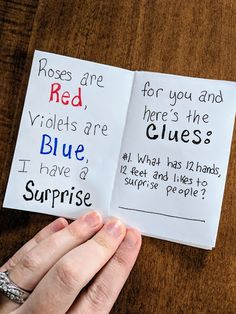 someone is holding up two pieces of paper with words on it that read, red, blue, and surprise