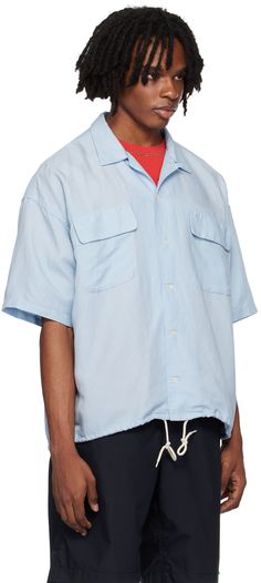 Breathable cupro- and hemp-blend twill shirt. · Open spread collar · Button closure · Flap pockets · Drawstring at hem · Dropped shoulders · Box pleat at back yoke · Mother-of-pearl hardware Supplier color: Sax Casual Blue Tops With Flap Pockets, Relaxed Fit Short Sleeve Button-up Shirt With Patch Pockets, Summer Shirt With Flap Pockets And Relaxed Fit, Relaxed Fit Shirt With Flap Pockets For Summer, Summer Relaxed Fit Shirt With Flap Pockets, Unstructured Short Sleeve Shirt With Spread Collar And Pockets, Summer Shirt With Flap Pockets And Spread Collar, Summer Collared Shirt With Flap Pockets, Casual Summer Shirt With Flap Pockets