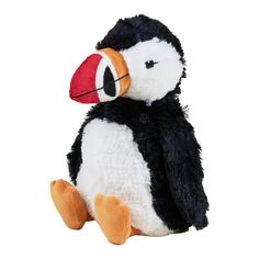 a black and white stuffed animal with a red beak