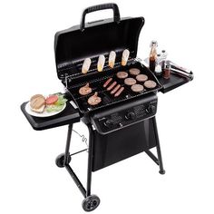 an outdoor grill with hamburgers and hot dogs cooking on it