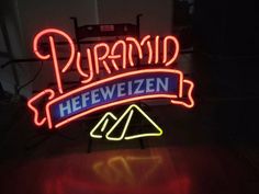 a neon sign that says puramd heeeweizen