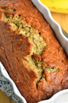 a loaf of banana bread sitting on top of a blue and white plate