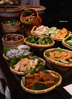 several baskets filled with food sitting on top of a table