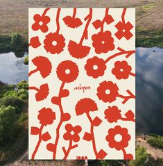 an aerial view of a lake with red flowers and the word poppy written on it