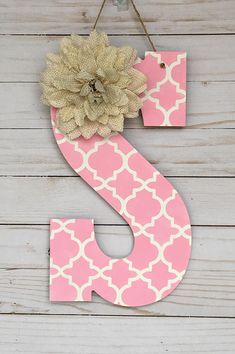 a pink and white sign that says spring door hanger with a flower on it