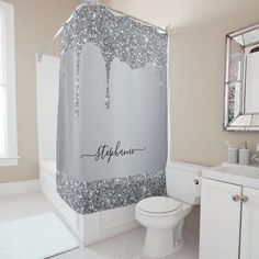 a bathroom with a shower curtain that has the name stephanie on it