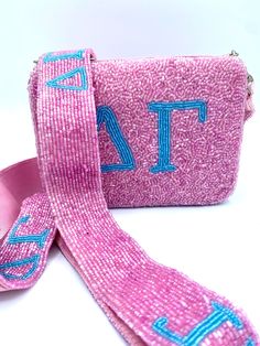 Delta Gamma girls will adore this darling beaded coin purse and beaded purse strap set...so, go ahead and select the most fabulous stadium approved beaded handbag and matching purse strap. This is the most fashionable addition to your Delta Gamma stadium approved clear bag or any handbag that the strap can be swapped out to your own bag or add one of our clear handbags to your order, to change up your look or your #ootd . These are licensed and sorority approved. Zipper top purse measures 4.5"X6 Adjustable Beaded Rectangular Bags, Adjustable Rectangular Beaded Bags, Beaded Purse Strap, Delta Gamma Sorority, Beaded Coin Purse, Tri Delt, Clear Handbags, Custom Strap, Alpha Chi Omega