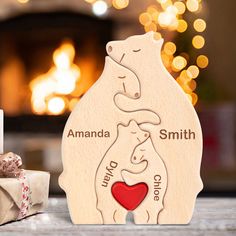 a personalized wooden christmas ornament with a polar bear holding a heart