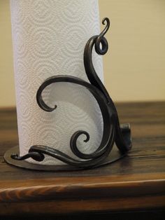 a close up of a toilet paper holder on a table